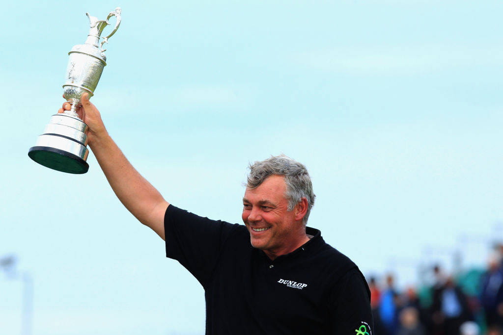 Darren Clarke lifts the Claret Jug aloft at The 140th Open.